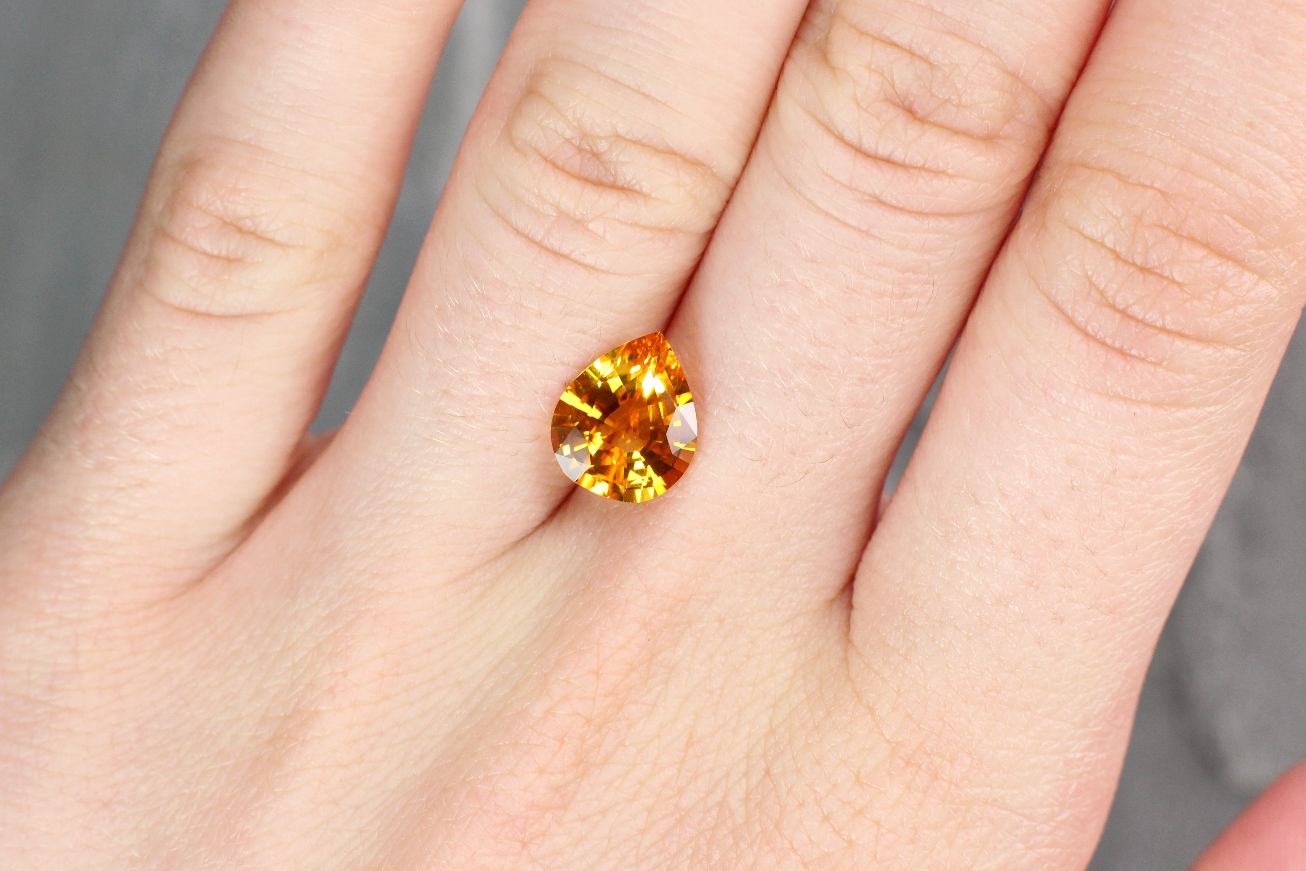 3.40ct Orangy Yellow, Pear Shape Sapphire, Heated, Sri Lanka - 10.50 x 8.80 x 4.89mm